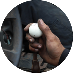 Hand resting on car gearstick