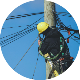 Worker fixing comms wires